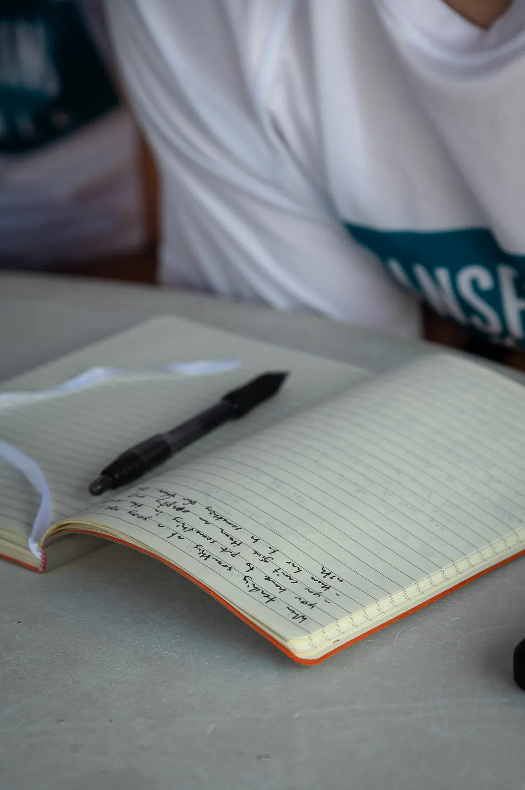 A camper's handwritten basketball notebook at Transforming Basketball camp