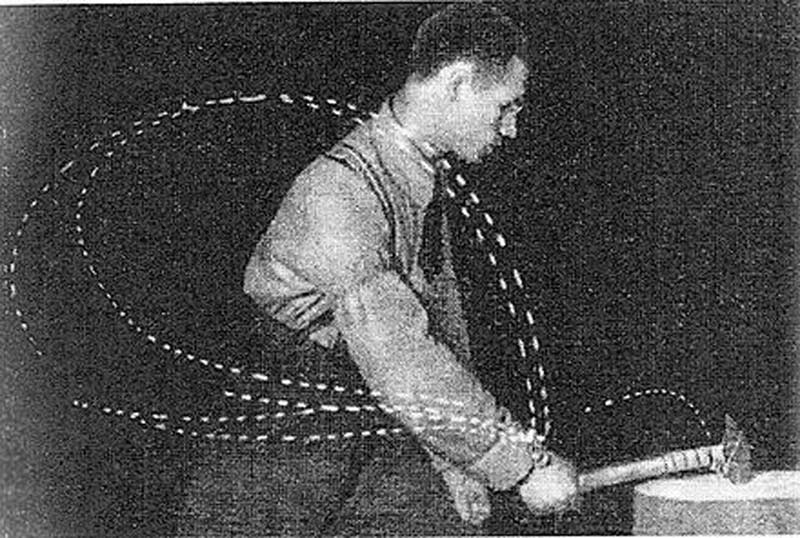 Vintage photo from Nikolai Bernstein's movement study showing a blacksmith's variable hammer trajectories, demonstrating the ecological dynamics concept of "repetition without repetition."