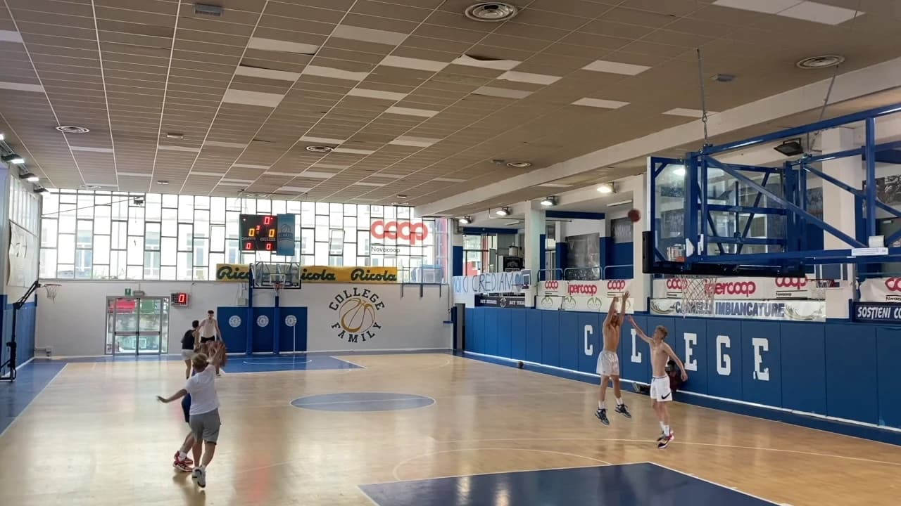 Two pairs of players practising contested jump shots in a Shooting System lesson